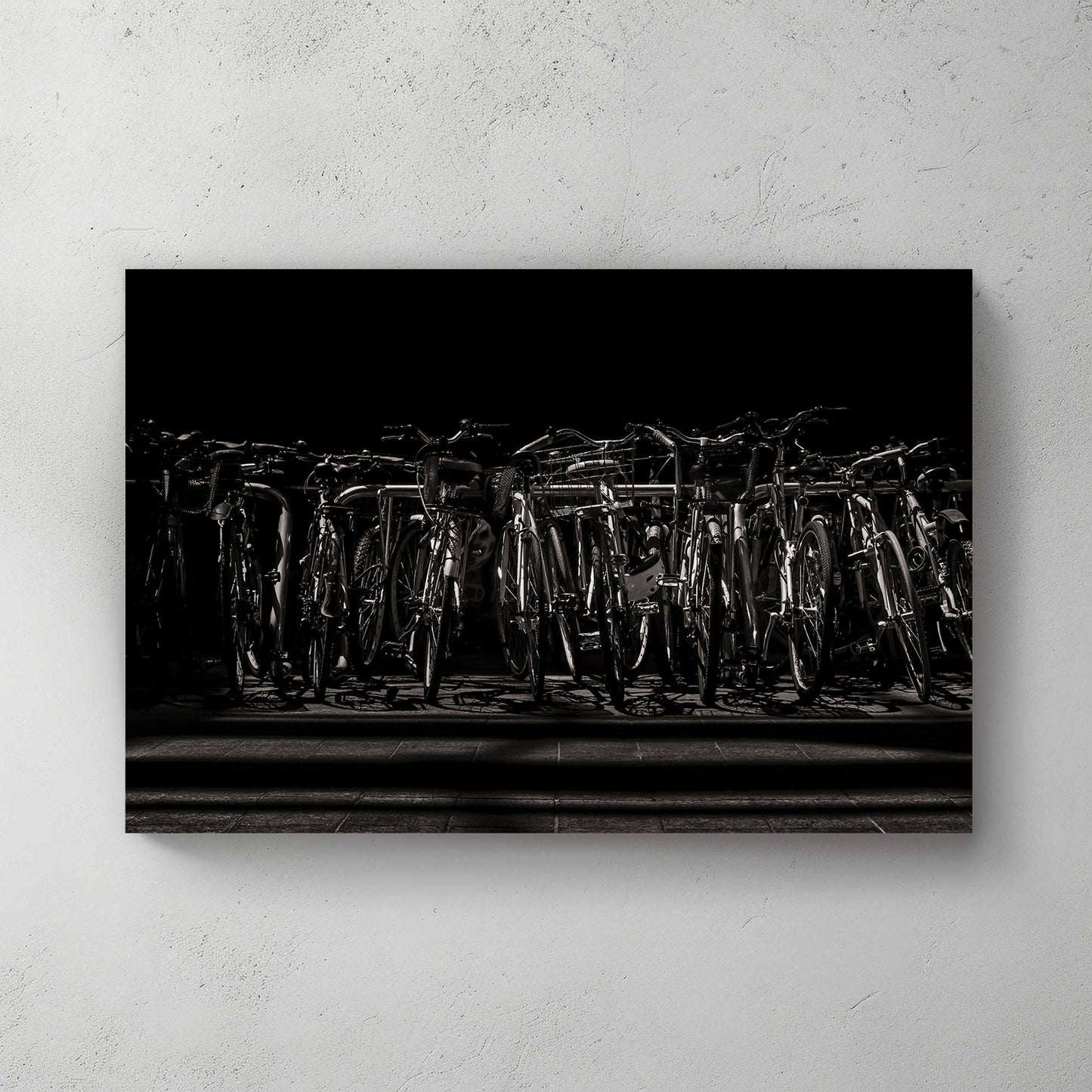 black and white urban bicycle rack wall art in dramatic shadows