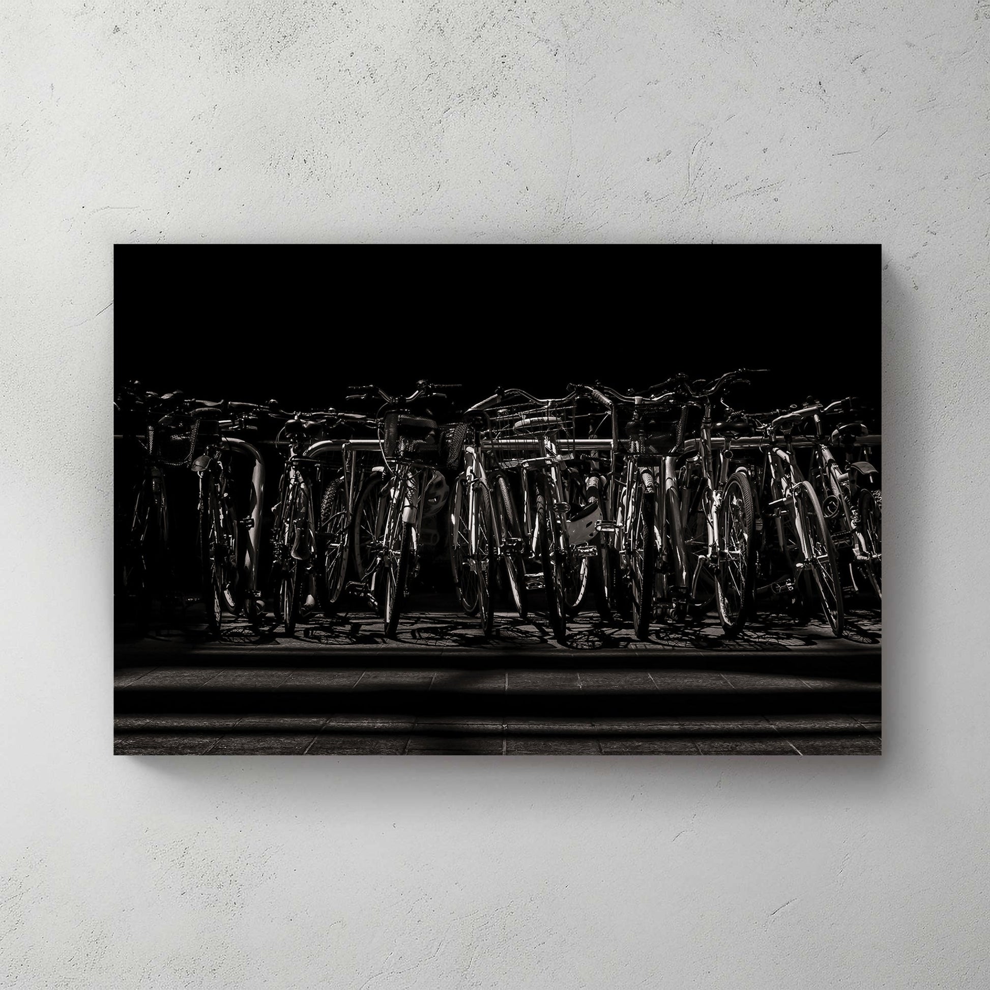 black and white urban bicycle rack wall art in dramatic shadows