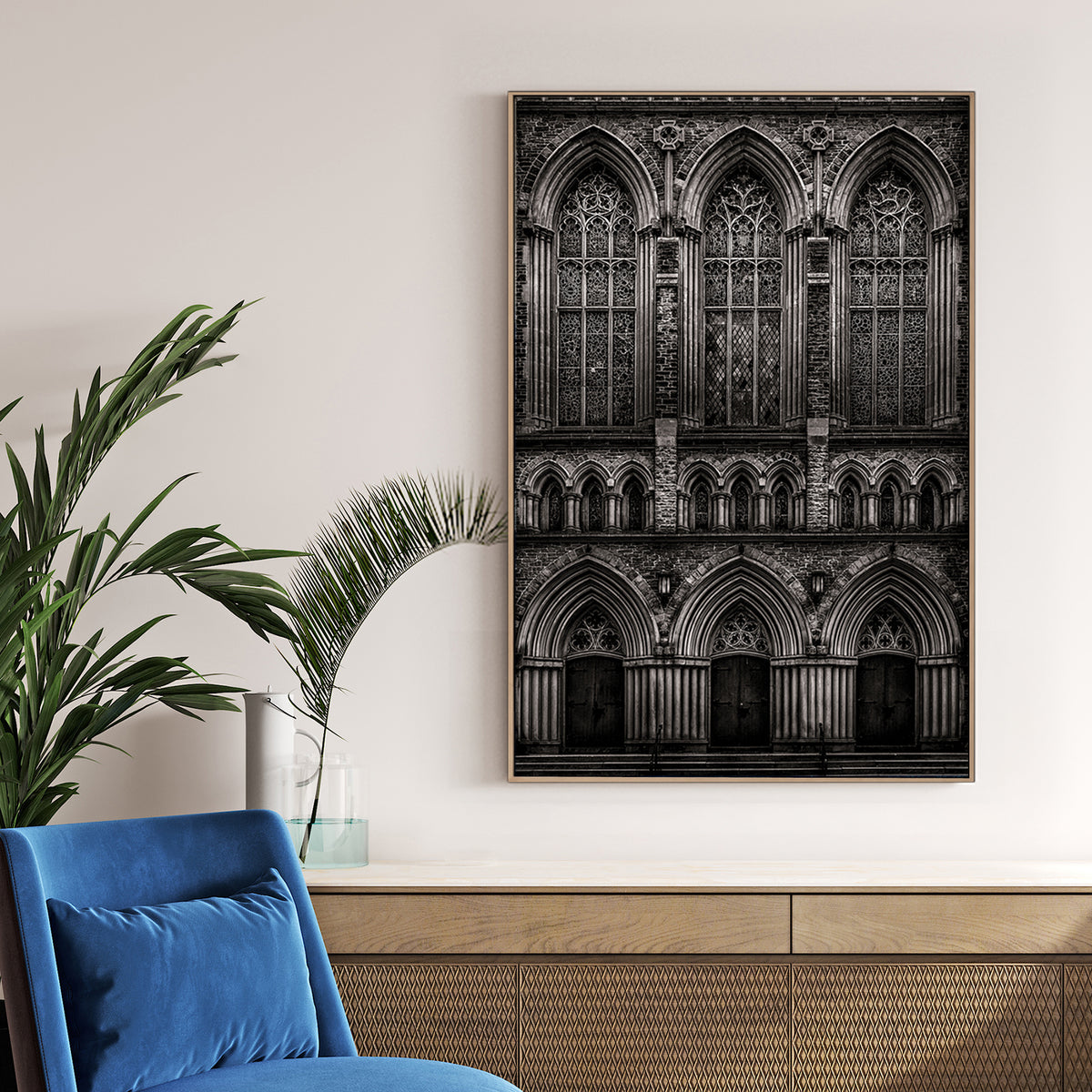 black and white photo of gothic church façade with stained glass windows and arched doors