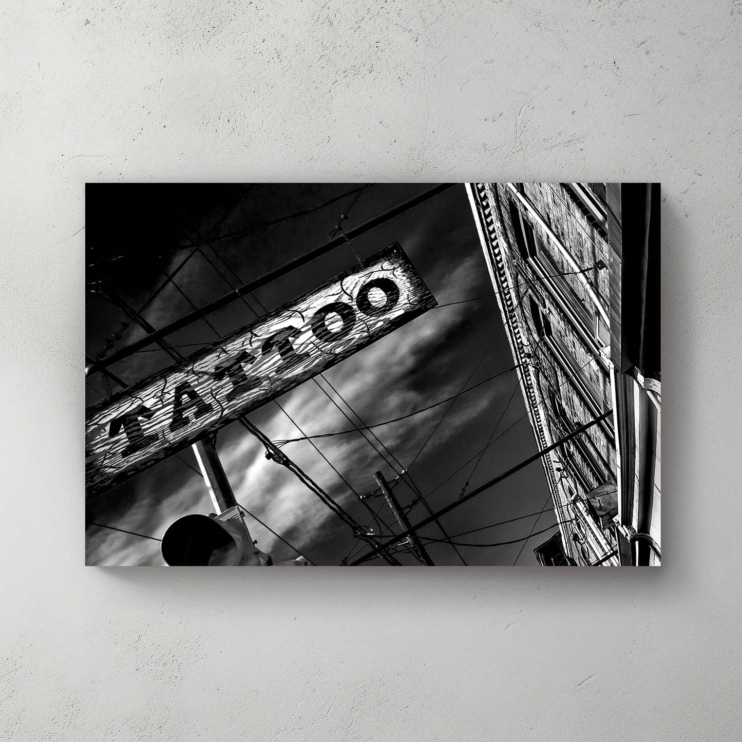 black and white photo of tattoo parlour storefront with neon signs and urban street details