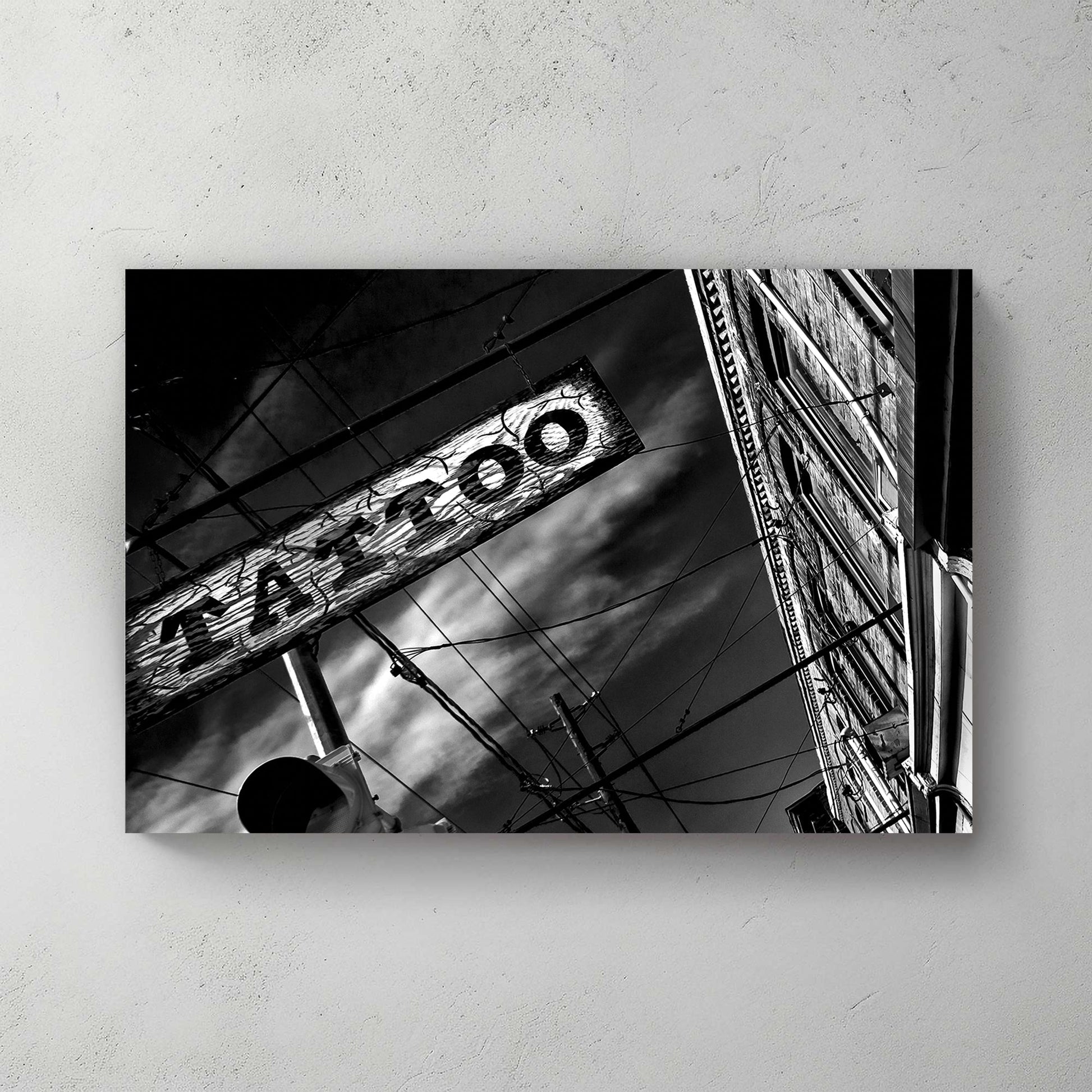 black and white photo of tattoo parlour storefront with neon signs and urban street details