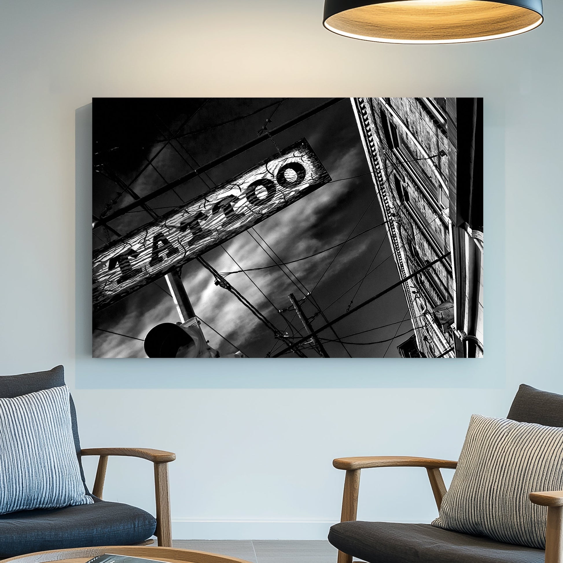 black and white photo of tattoo parlour storefront with neon signs and urban street details