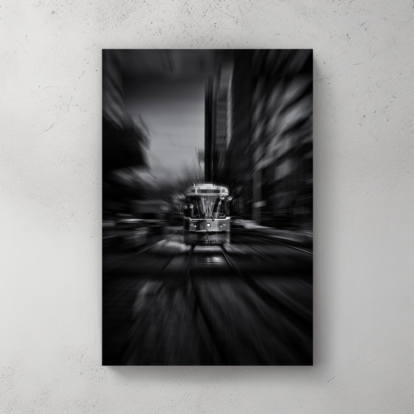 black and white photo of Toronto 512 streetcar with motion blur in city