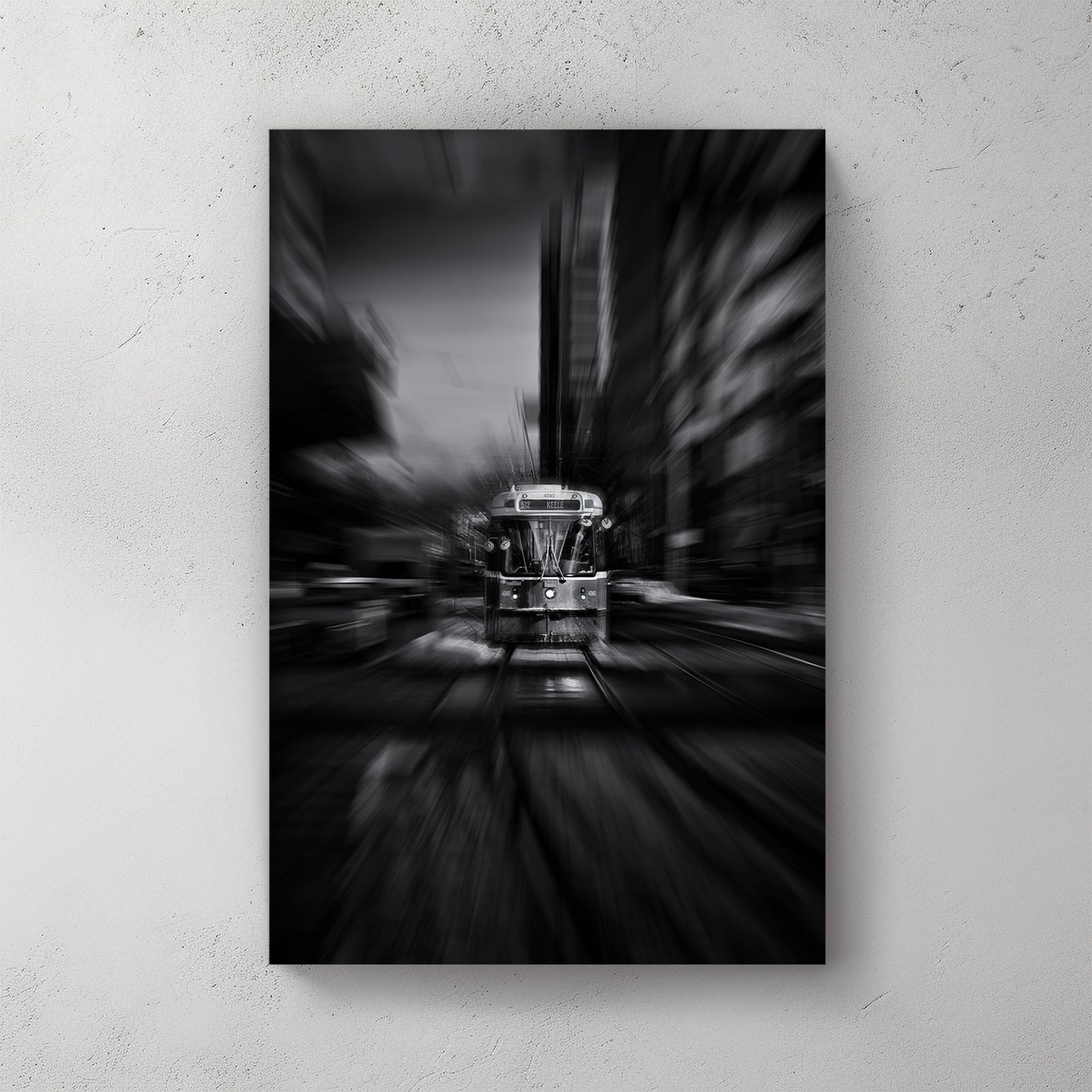 black and white photo of Toronto 512 streetcar with motion blur in city
