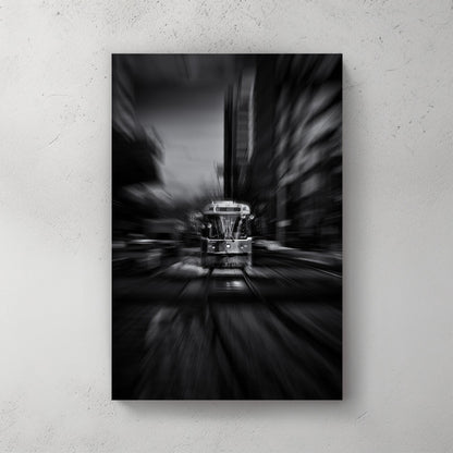 black and white photo of Toronto 512 streetcar with motion blur in city