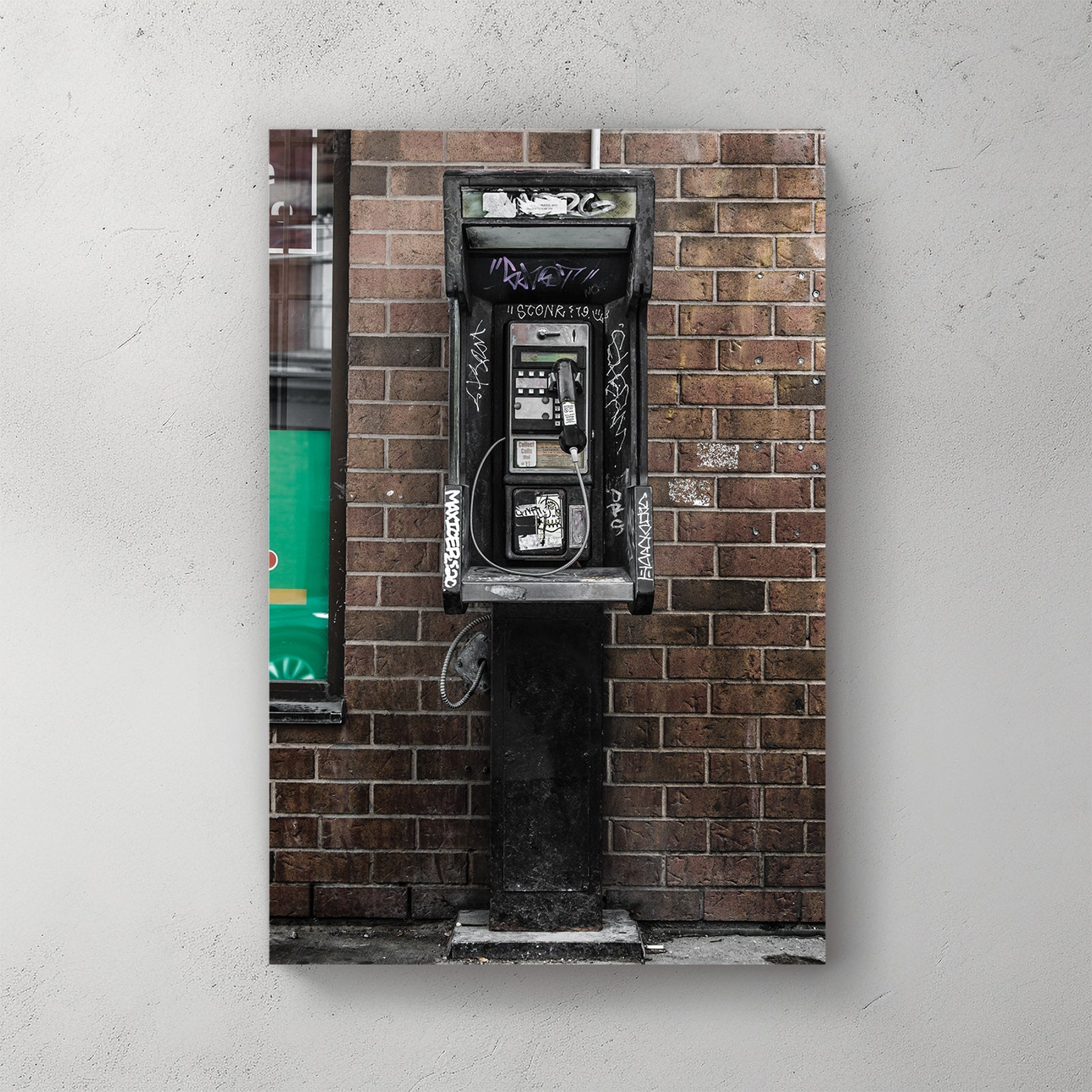 gritty urban phone booth wall art with graffiti and brick wall