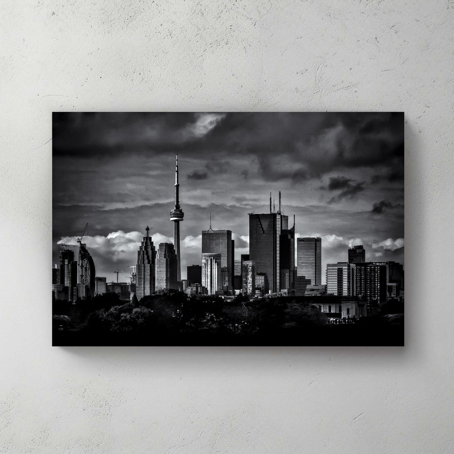 dramatic black and white toronto skyline wall art with stormy clouds