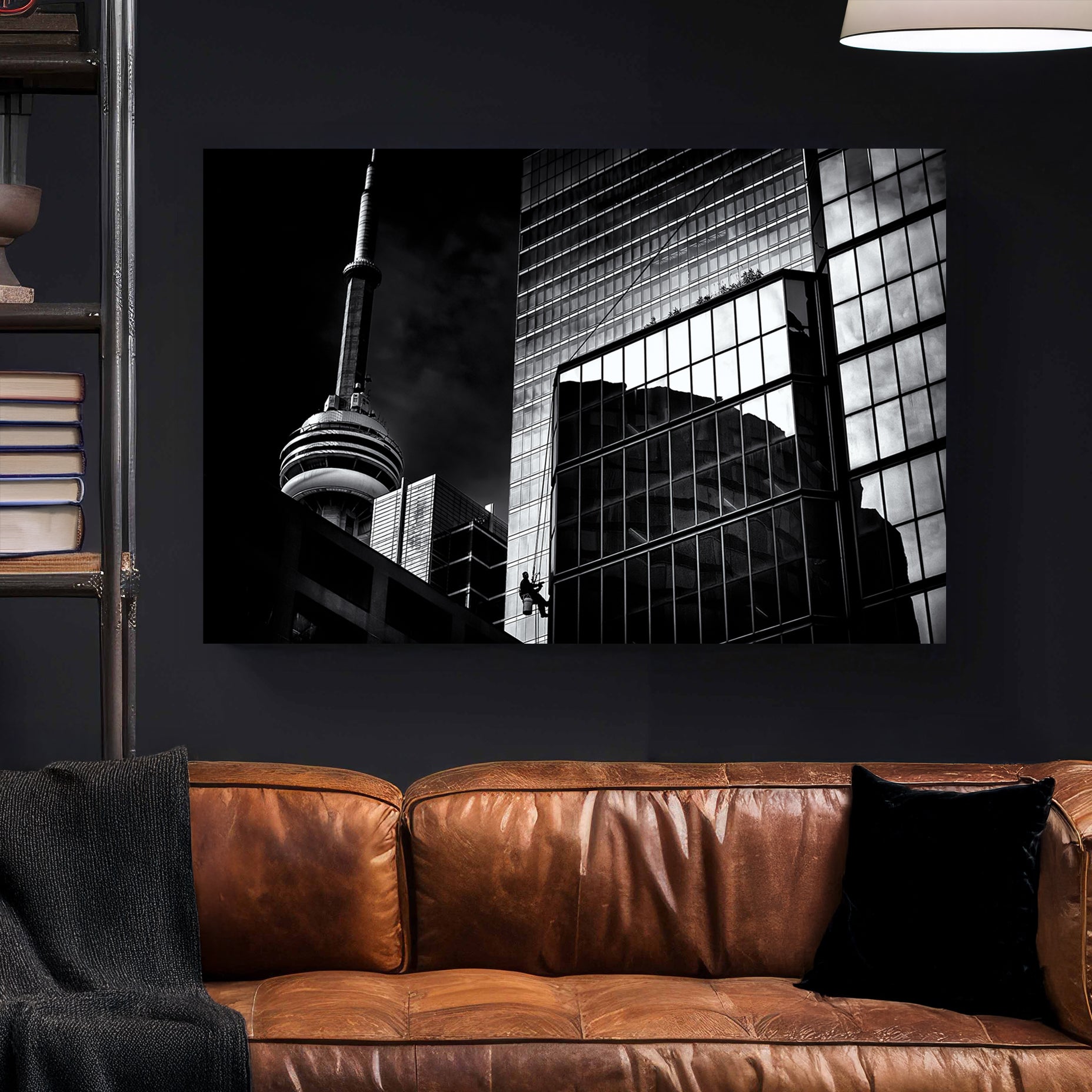 black and white Toronto photo with CN Tower and window washer on glass building