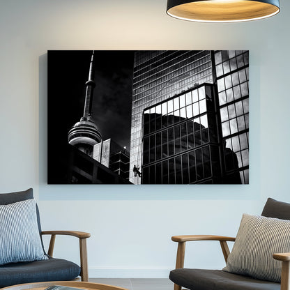 black and white Toronto photo with CN Tower and window washer on glass building