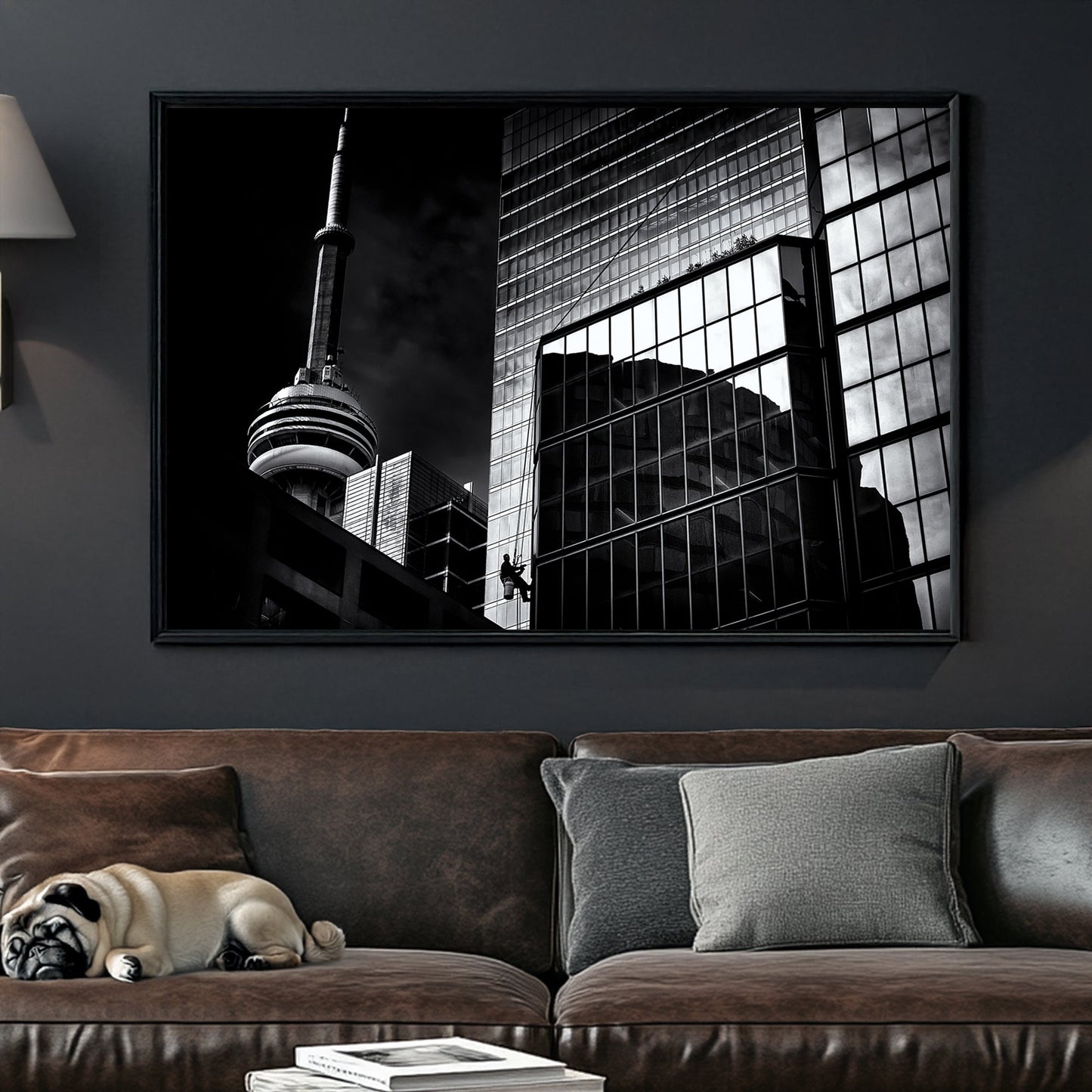 black and white Toronto photo with CN Tower and window washer on glass building