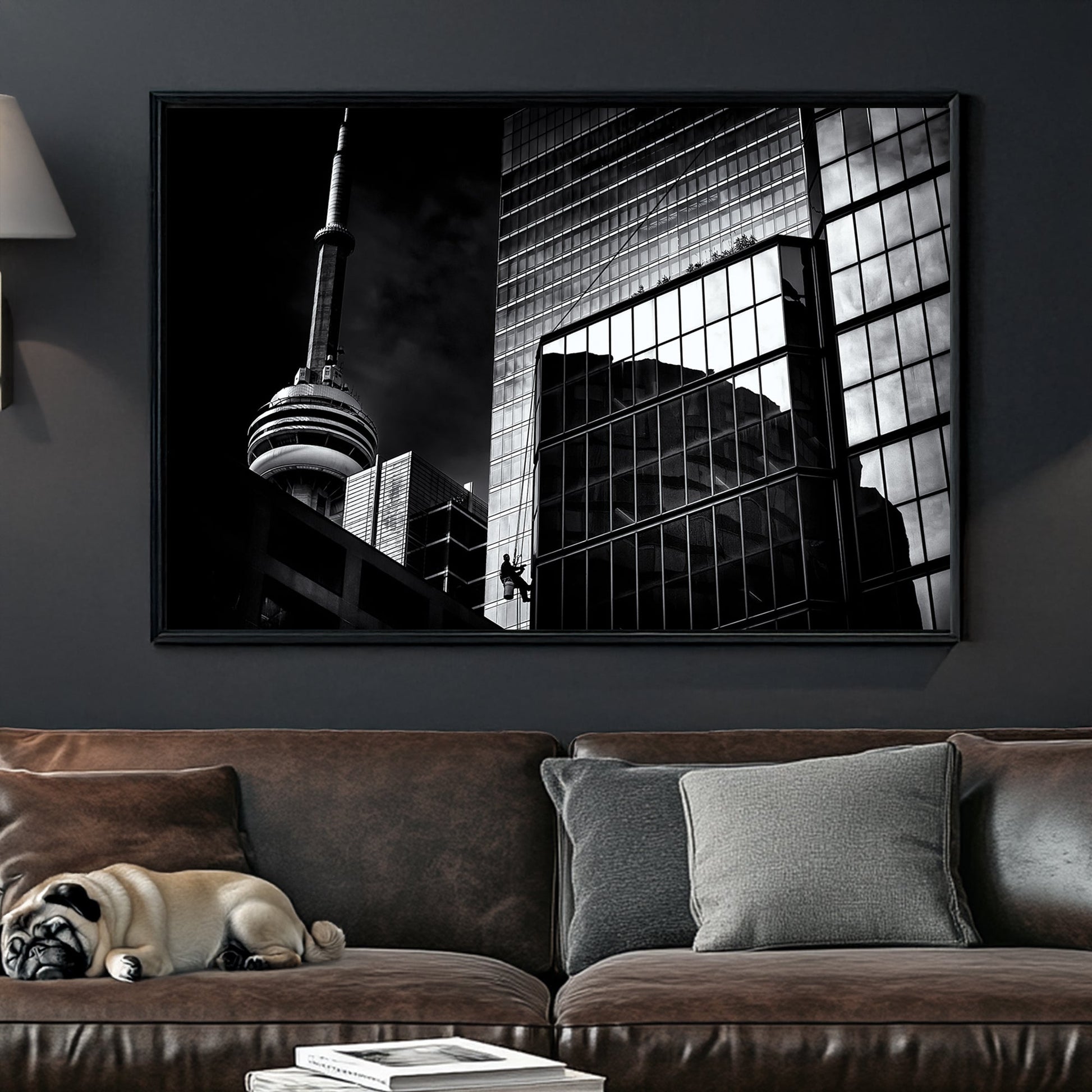 black and white Toronto photo with CN Tower and window washer on glass building