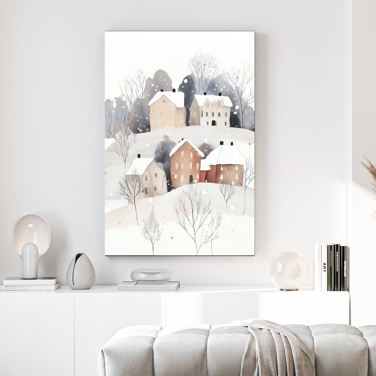 snowy hillside village wall art with glowing windows and minimalist winter trees