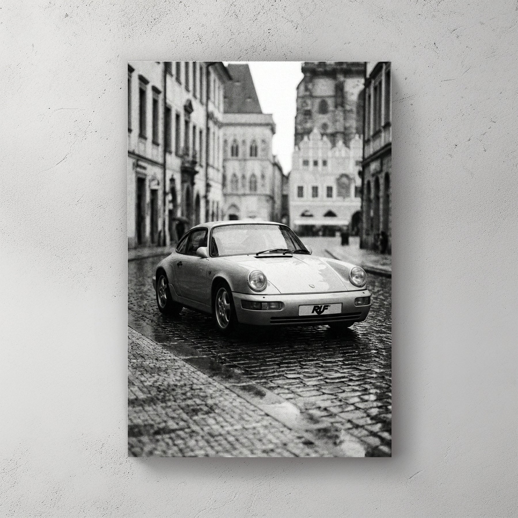 Monochrome RUF Porsche 911 on a European cobblestone street wall art.