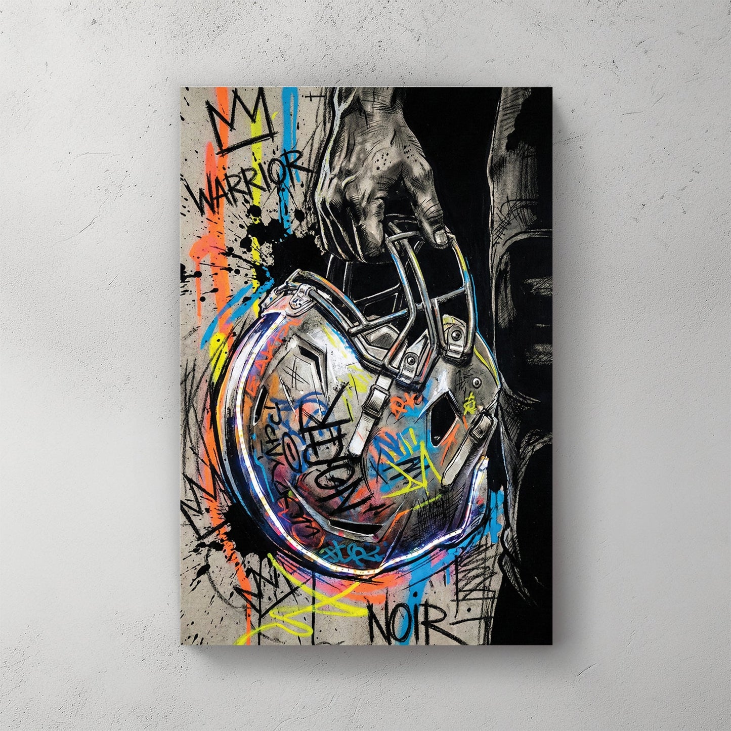 Football helmet wall art featuring a hand-held helmet with graffiti and street art details.