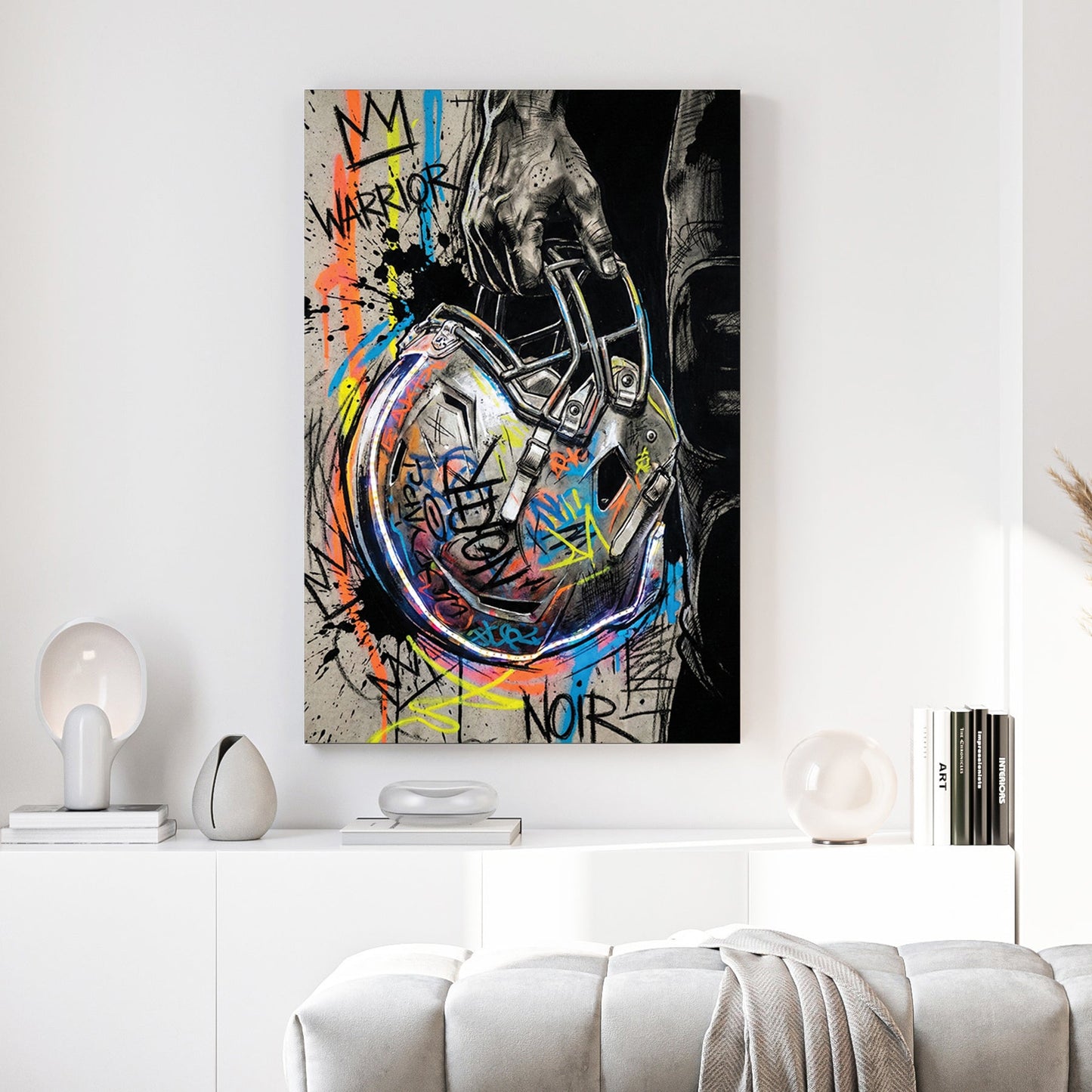 Football helmet wall art featuring a hand-held helmet with graffiti and street art details.