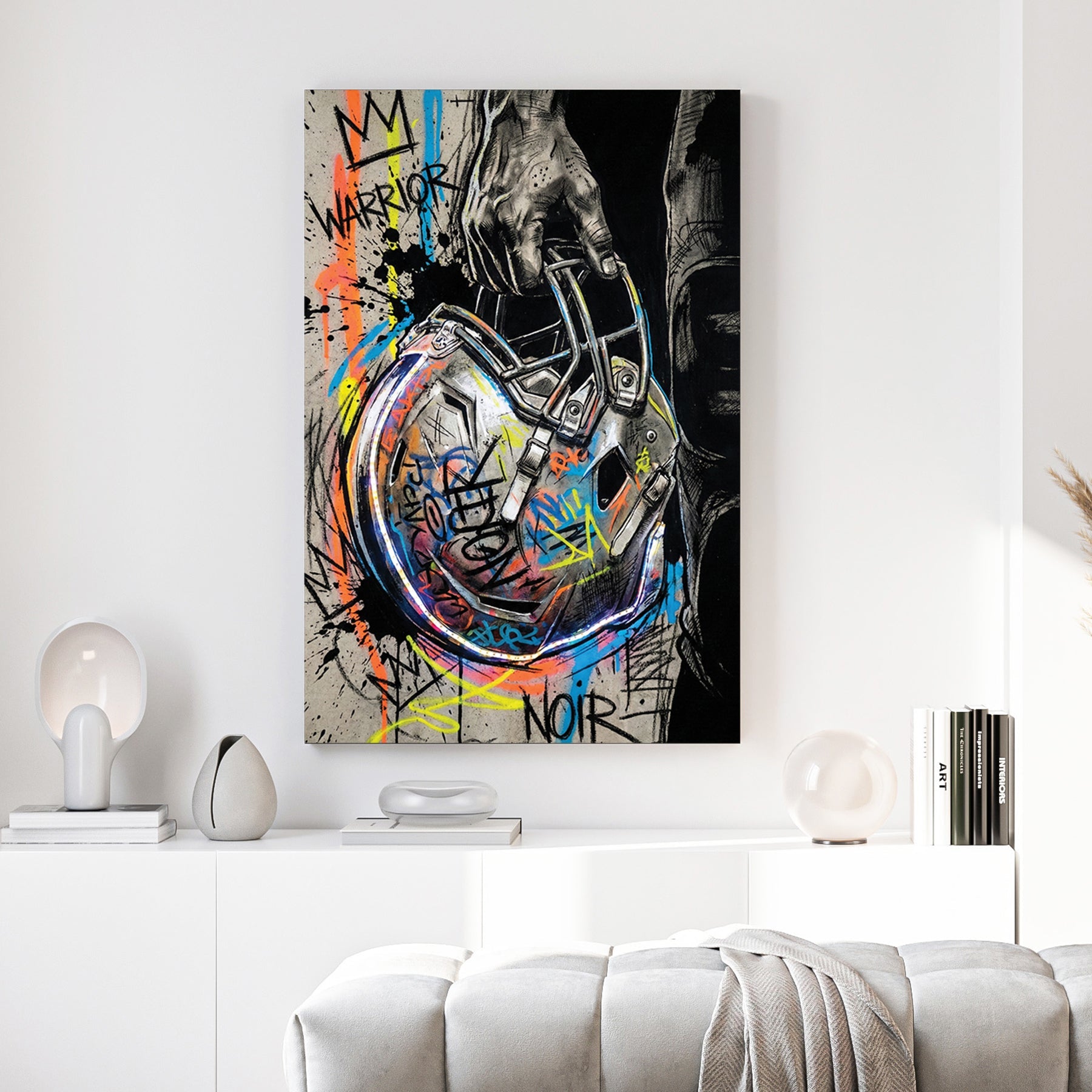 Football helmet wall art featuring a hand-held helmet with graffiti and street art details.