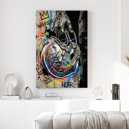 Football helmet wall art featuring a hand-held helmet with graffiti and street art details.