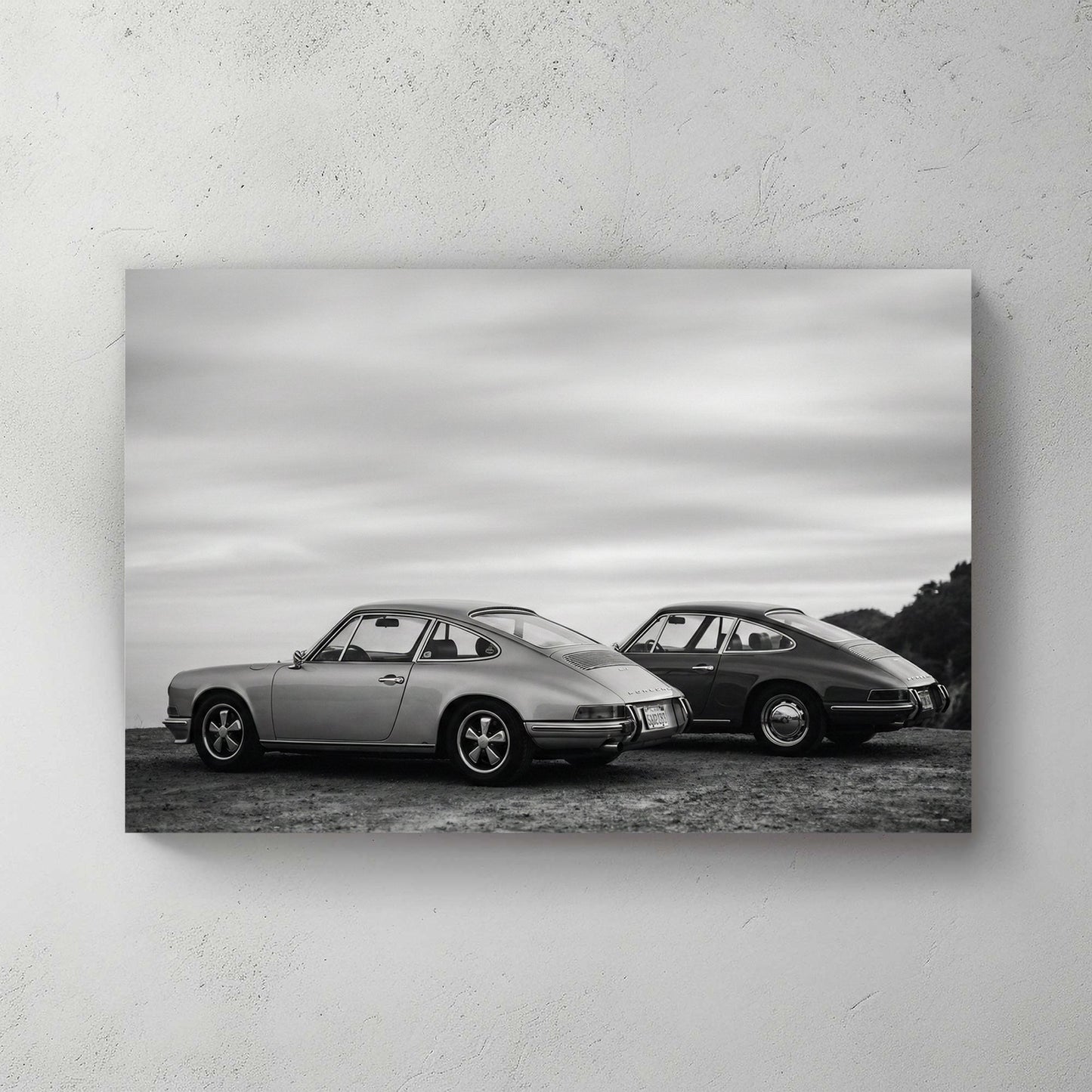 Two vintage Porsche 911 cars in black and white photography wall art.
