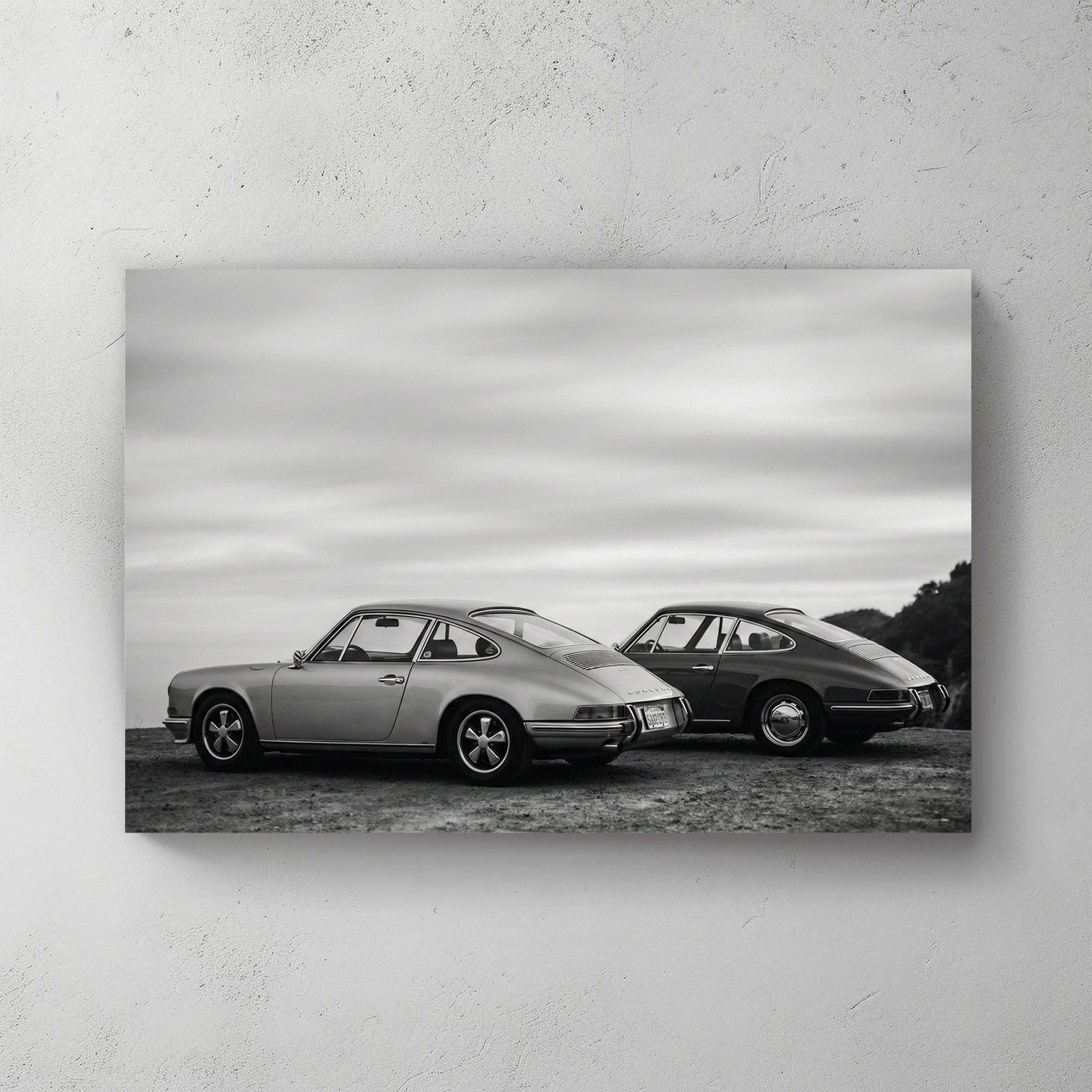Two vintage Porsche 911 cars in black and white photography wall art.