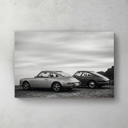 Two vintage Porsche 911 cars in black and white photography wall art.