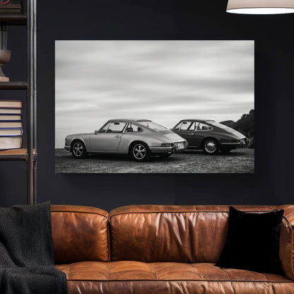Two vintage Porsche 911 cars in black and white photography wall art.