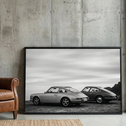Two vintage Porsche 911 cars in black and white photography wall art.