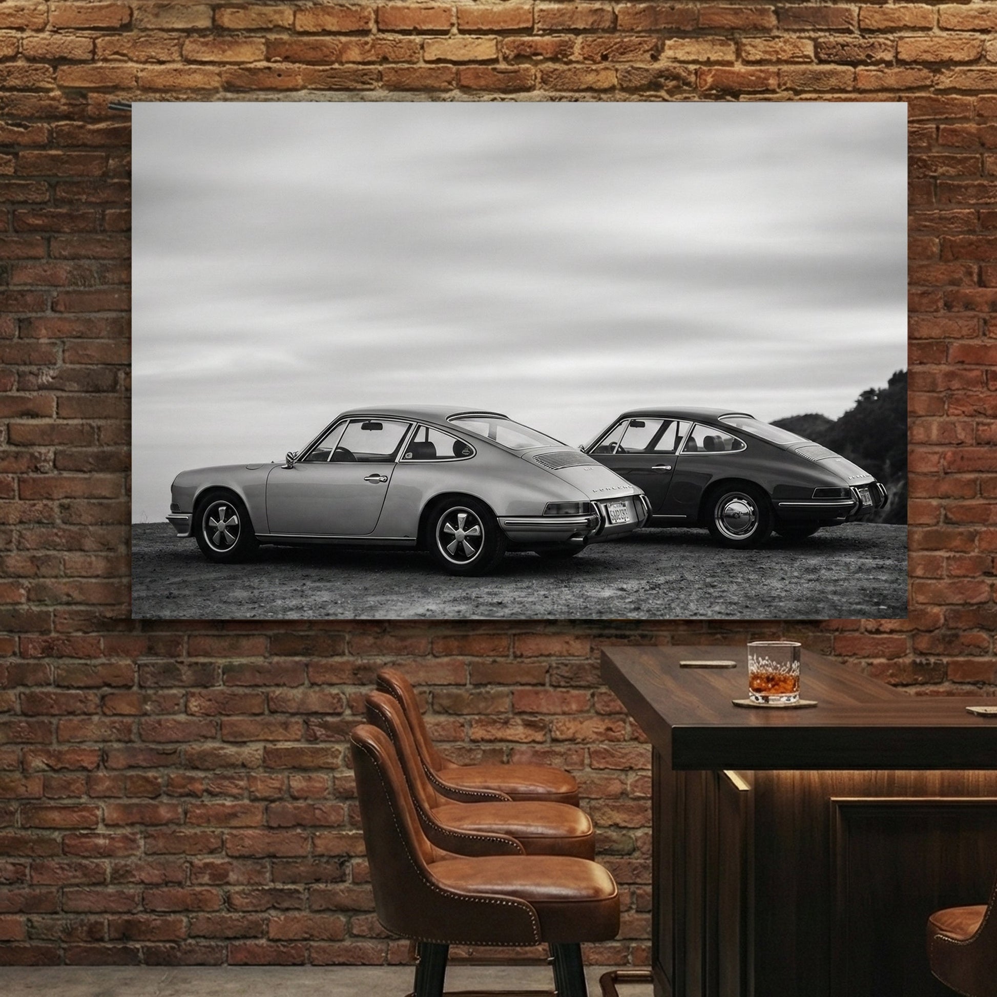 Two vintage Porsche 911 cars in black and white photography wall art.
