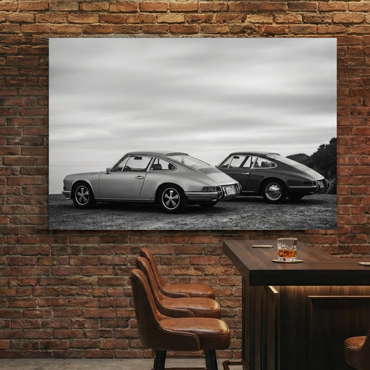 Two vintage Porsche 911 cars in black and white photography wall art.
