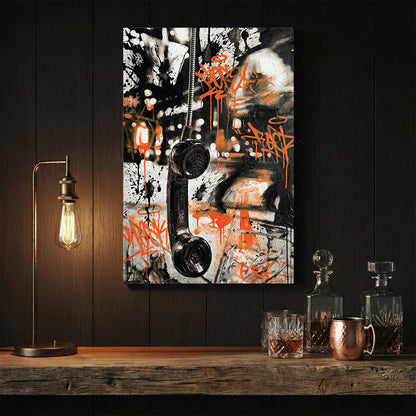 Vintage telephone handset wall art with orange graffiti tags and black marks.
