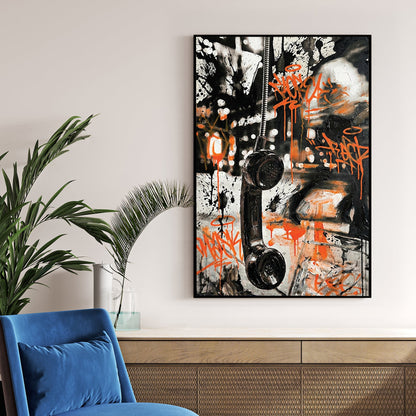 Vintage telephone handset wall art with orange graffiti tags and black marks.