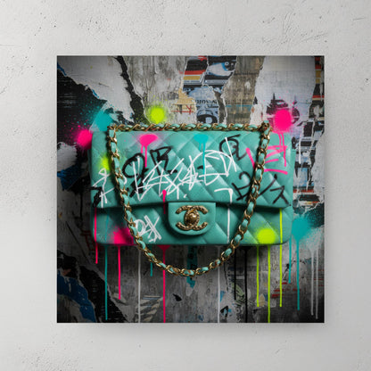 Graffiti Chanel bag wall art with neon paint tags on an urban poster background.