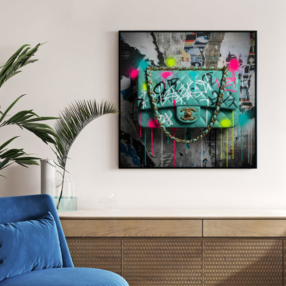 Graffiti Chanel bag wall art with neon paint tags on an urban poster background.
