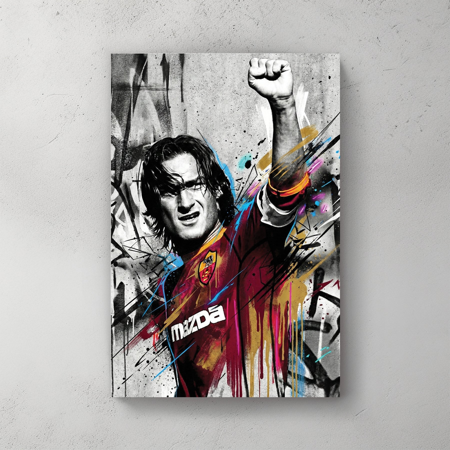 Francesco Totti street art wall art with raised fist and colourful urban drips.