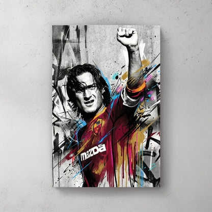 Francesco Totti street art wall art with raised fist and colourful urban drips.