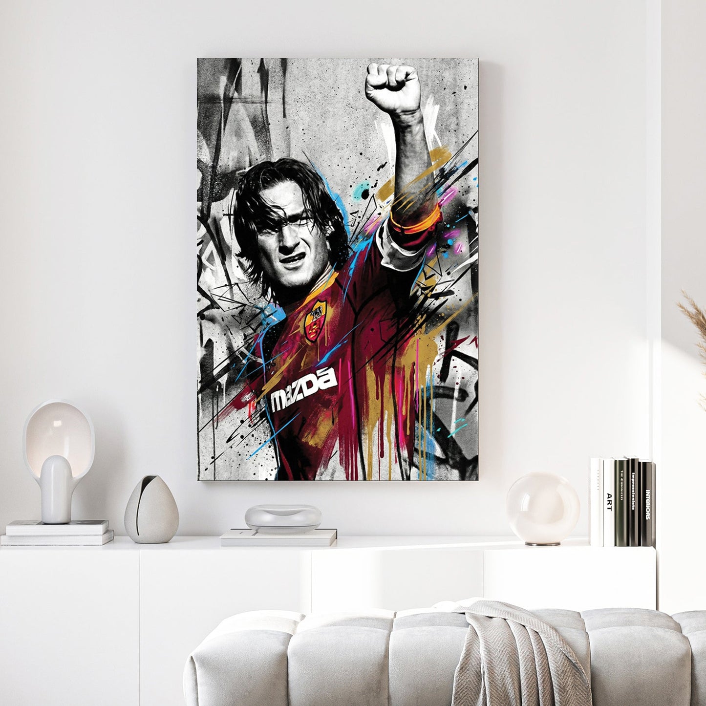Francesco Totti street art wall art with raised fist and colourful urban drips.