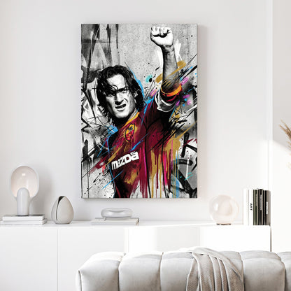 Francesco Totti street art wall art with raised fist and colourful urban drips.