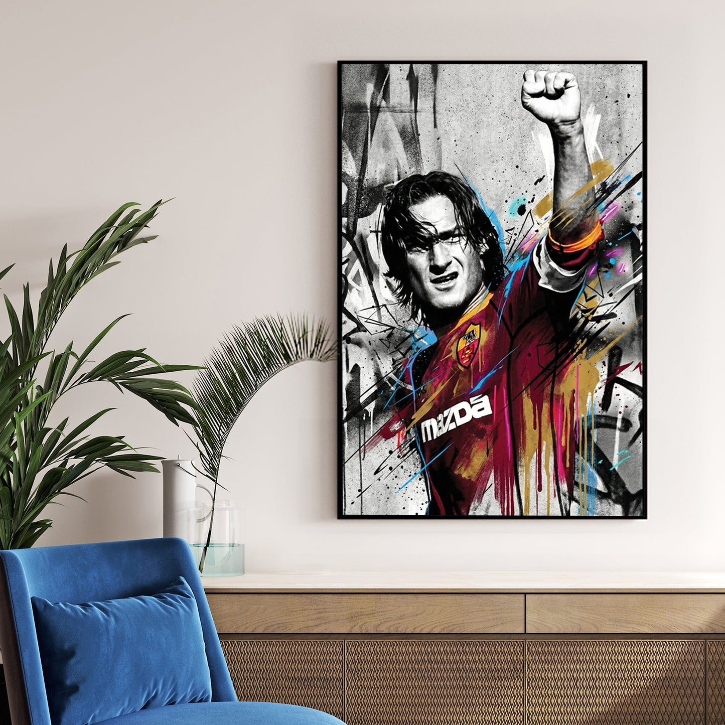 Francesco Totti street art wall art with raised fist and colourful urban drips.