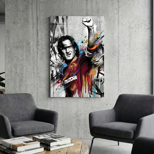 Francesco Totti street art wall art with raised fist and colourful urban drips.