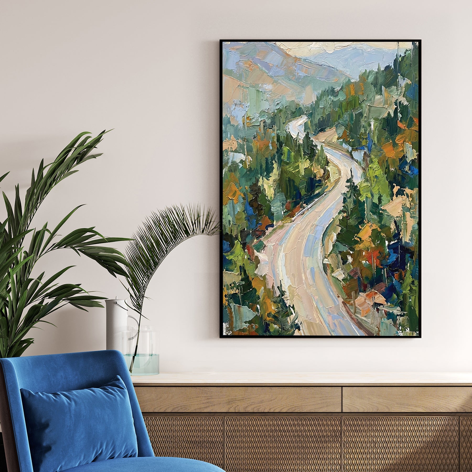 Impressionist wall art of a winding mountain road through a green forest.