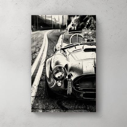 Black and white Shelby Cobra urban street art wall art with graffiti tags.