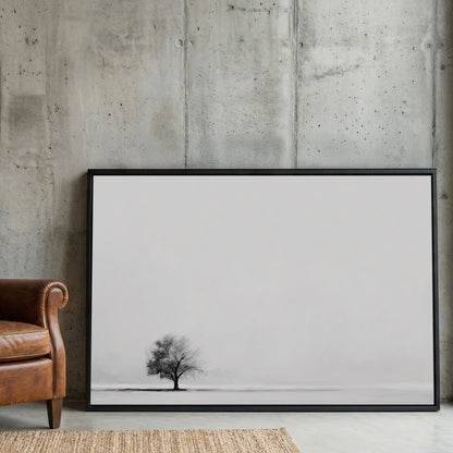 Minimalist wall art featuring a single tree in a monochrome landscape.