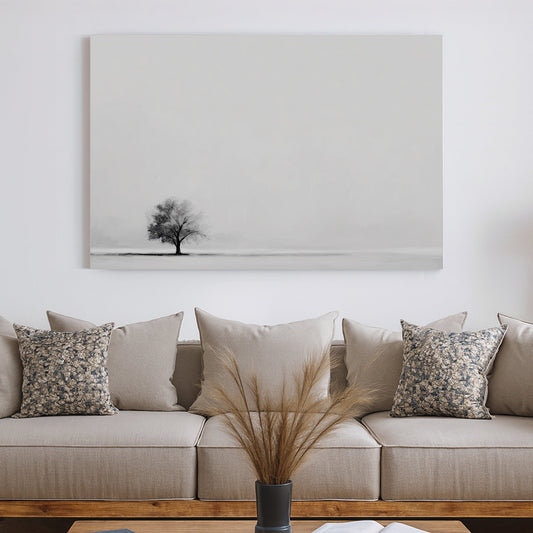 Minimalist wall art featuring a single tree in a monochrome landscape.