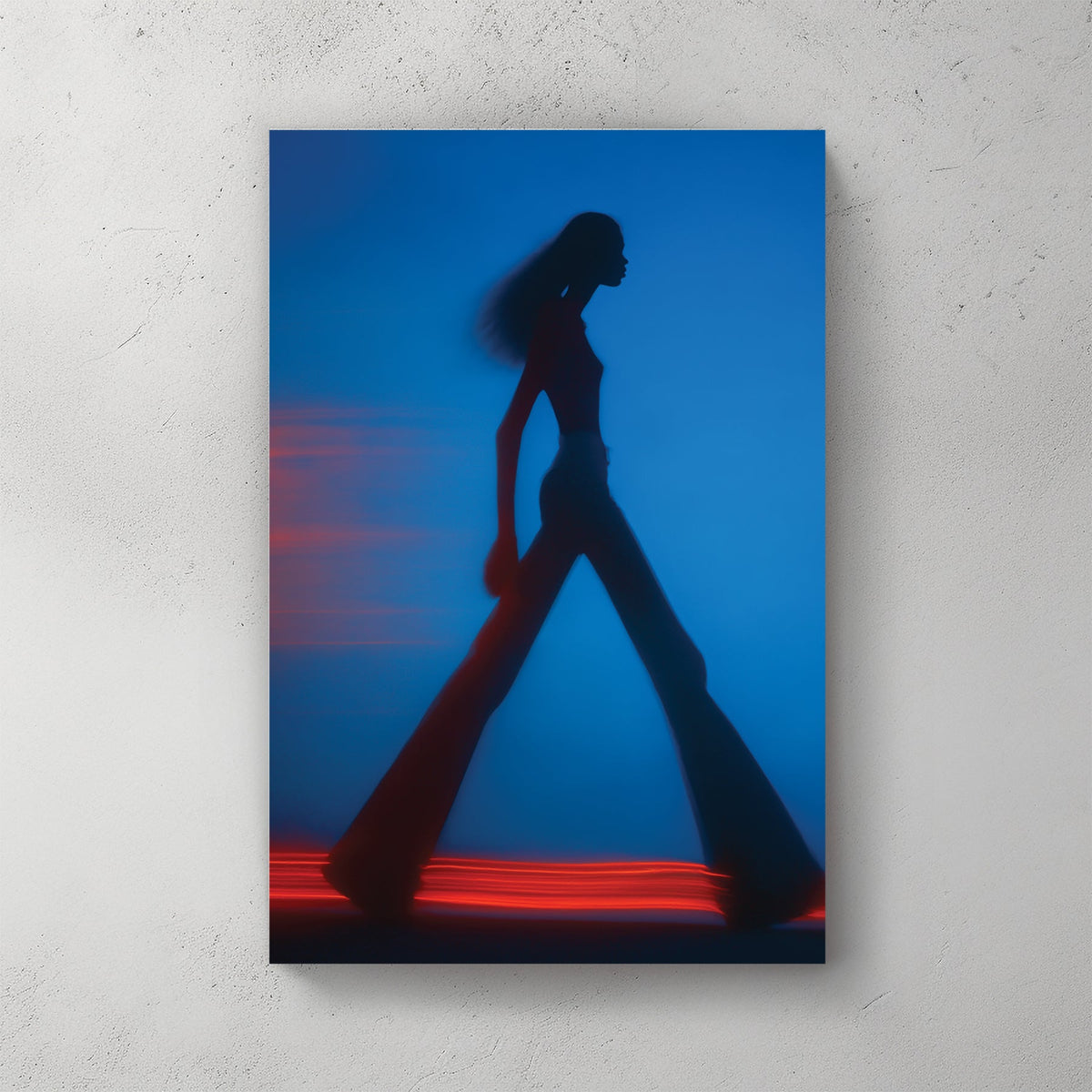 Blurred silhouette of a fashion model walking with red light trails wall art.
