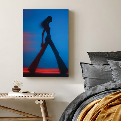 Blurred silhouette of a fashion model walking with red light trails wall art.