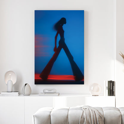 Blurred silhouette of a fashion model walking with red light trails wall art.