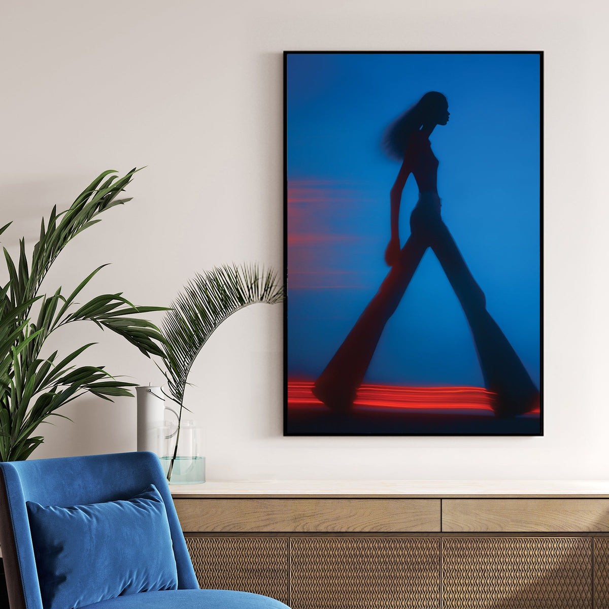 Blurred silhouette of a fashion model walking with red light trails wall art.