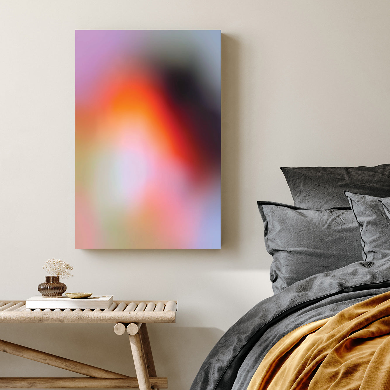 Blurred abstract gradient wall art with pink, orange, and purple soft tones.