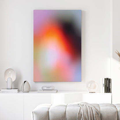 Blurred abstract gradient wall art with pink, orange, and purple soft tones.