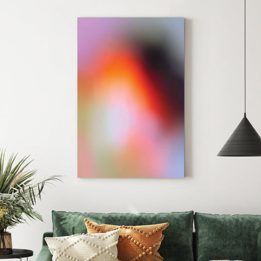 Blurred abstract gradient wall art with pink, orange, and purple soft tones.