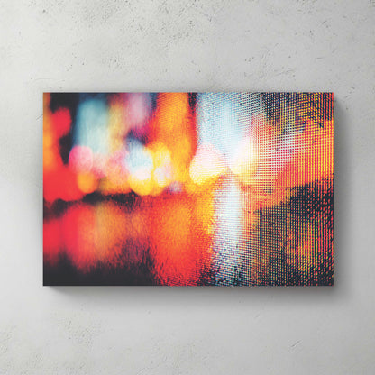 Abstract city lights photography wall art with red and yellow bokeh and digital pixel texture.